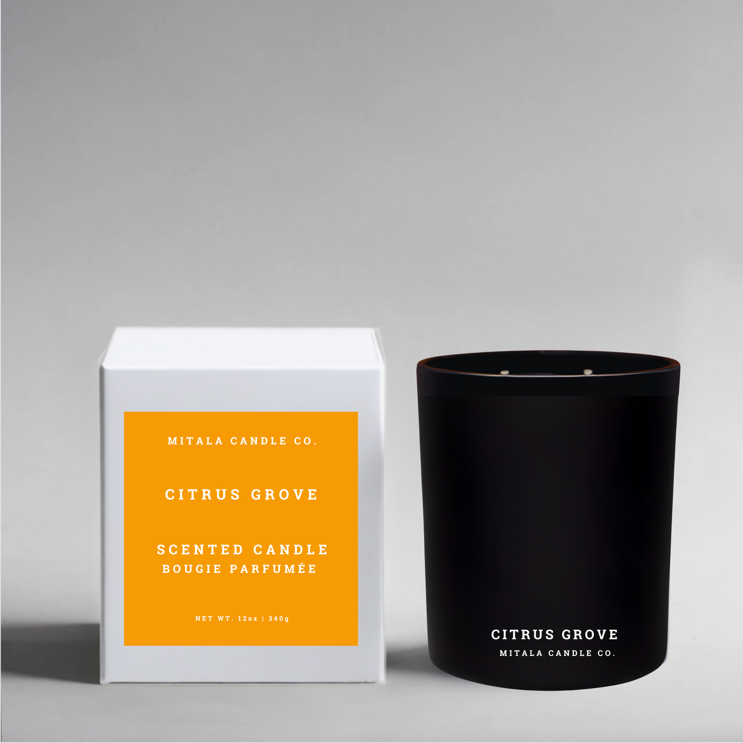 Luxury soy candle with 'Citrus Grove' and white packaging on a gray background
