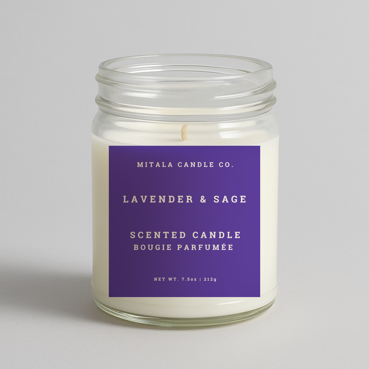 Mitala Candle Co. Lavender & Sage scented candle with purple label, 7.5oz, on light gray background