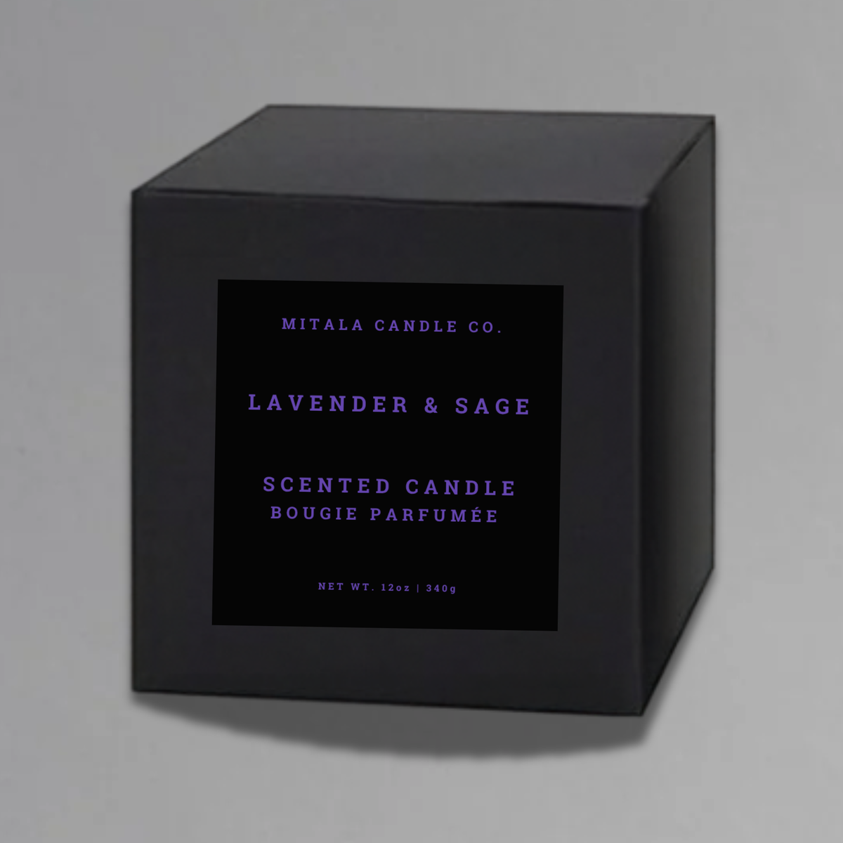 Luxury 12oz soy candle 'Lavender & Sage' by Mitala Candle Co. next to white gift box on gray background