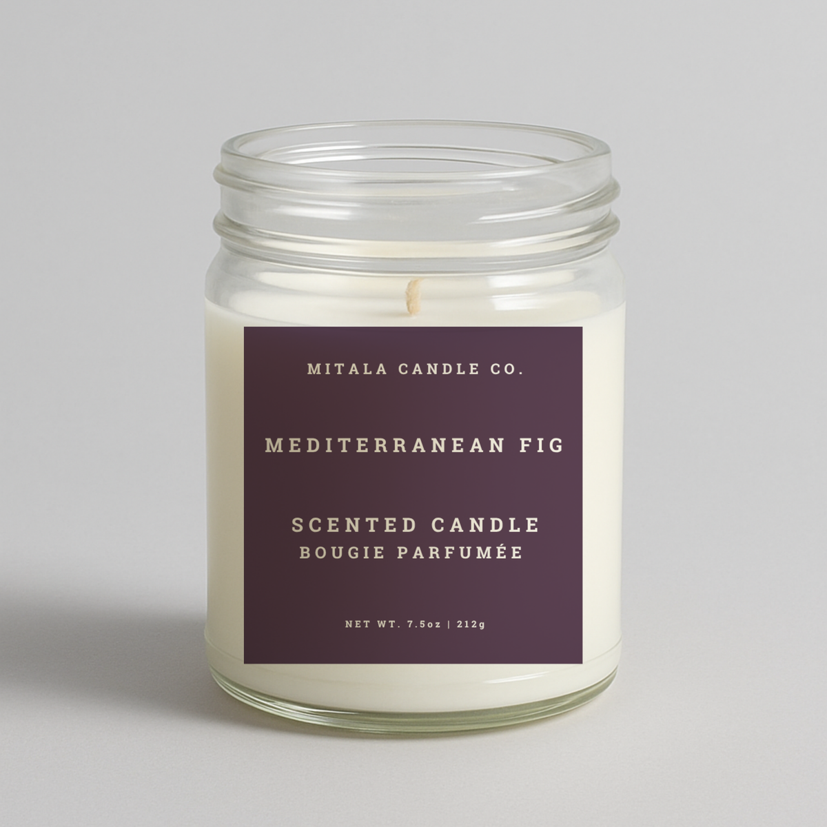Mitala Candle Co. Mediterranean Fig scented candle with purple label, 7.5oz, on light gray background