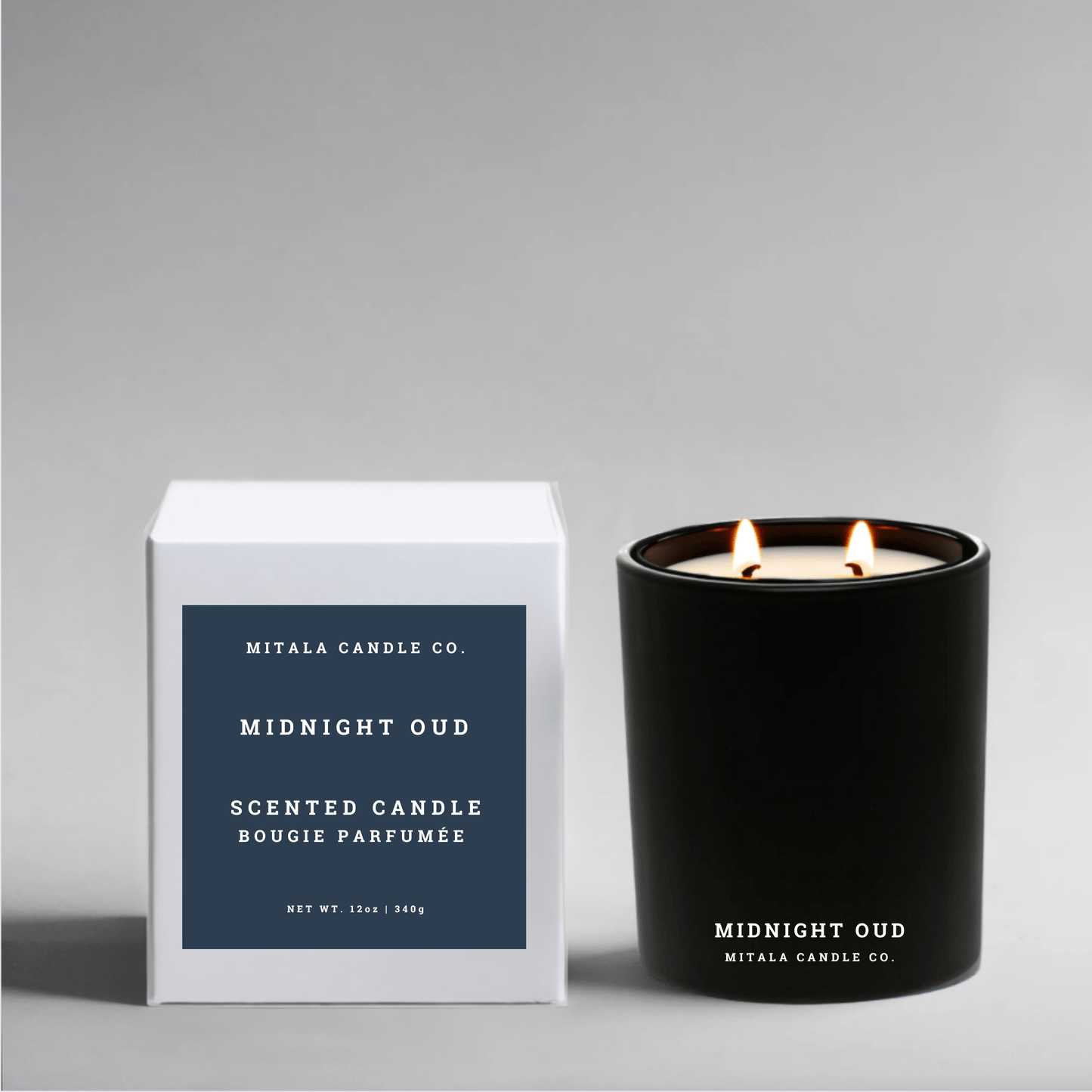 soy wax candle labeled 'Midnight Oud' with a white gift box on a gray background