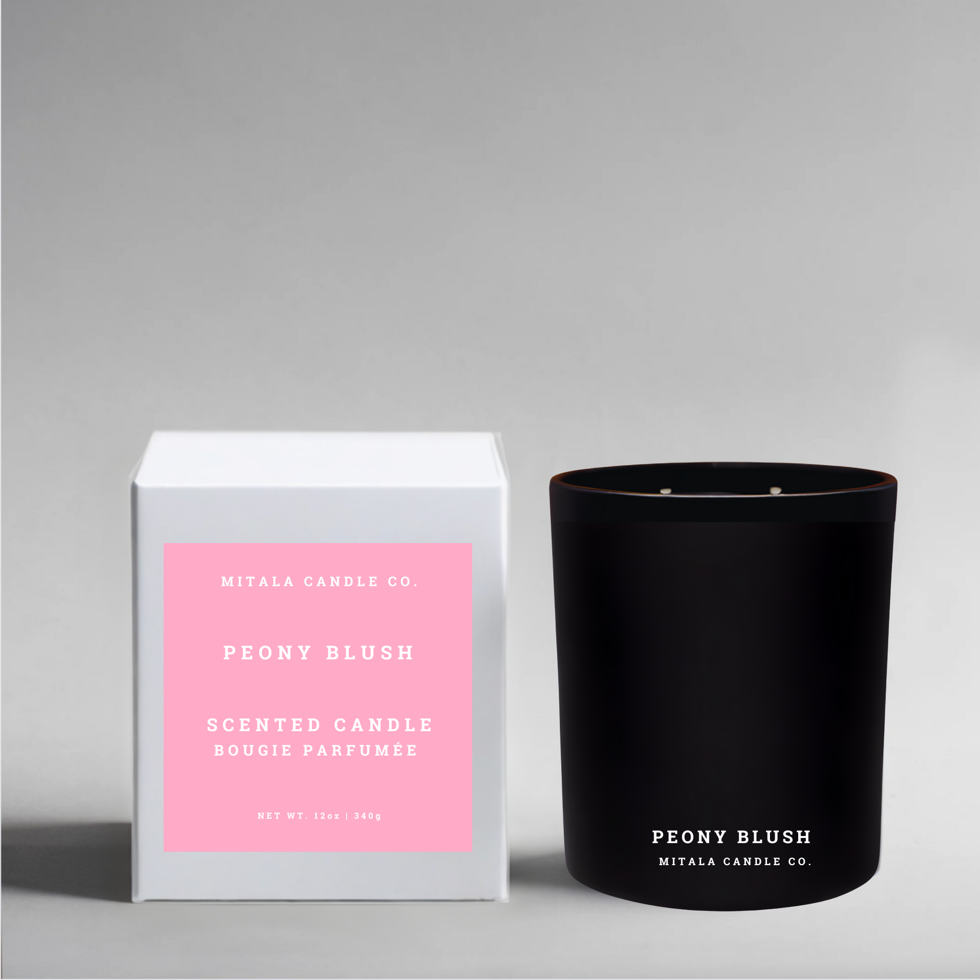 Eco-luxury soy candle in scent 'Peony Blush' with a white gift box on a gray background