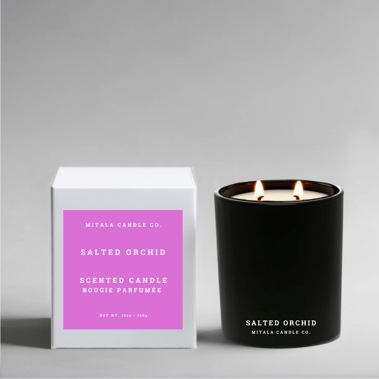 Eco-luxury soy candle with 'Salted Orchid' and white packaging on a gray background