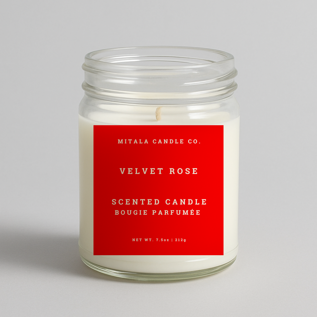 Mitala Candle Co. Velvet Rose scented candle with red label, 7.5oz, on light gray background