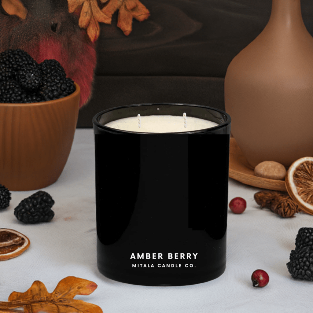 Mitala Candle Co. Amber Berry hand-poured scented candle with fruity & warm notes, in a black glass jar for a luxury home fragrance.