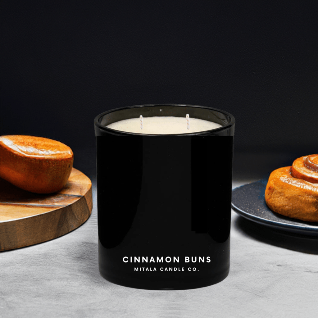 Mitala Candle Co. Cinnamon Buns hand-poured scented candle with spiced & sweet notes, in a black glass jar for a luxury home fragrance.