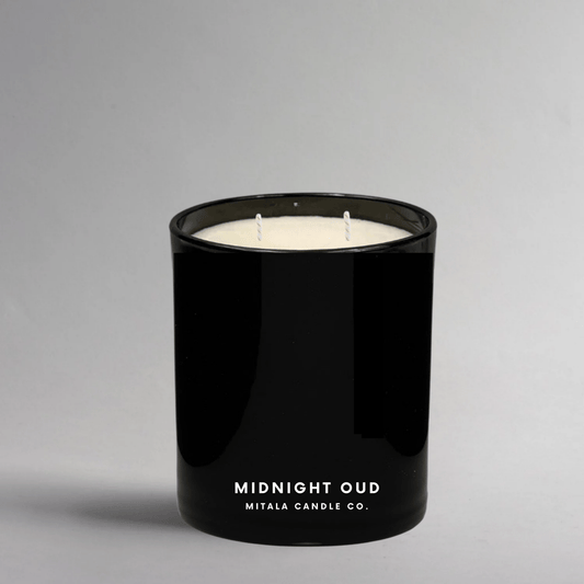 Mitala Candle Co. Midnight Out hand-poured scented candle with woody & floral notes, in a black glass jar for a luxury home fragrance.