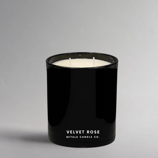 Mitala Candle Co. Velvet Rose hand-poured scented candle with floral notes, in a black glass jar for a luxury home fragrance.