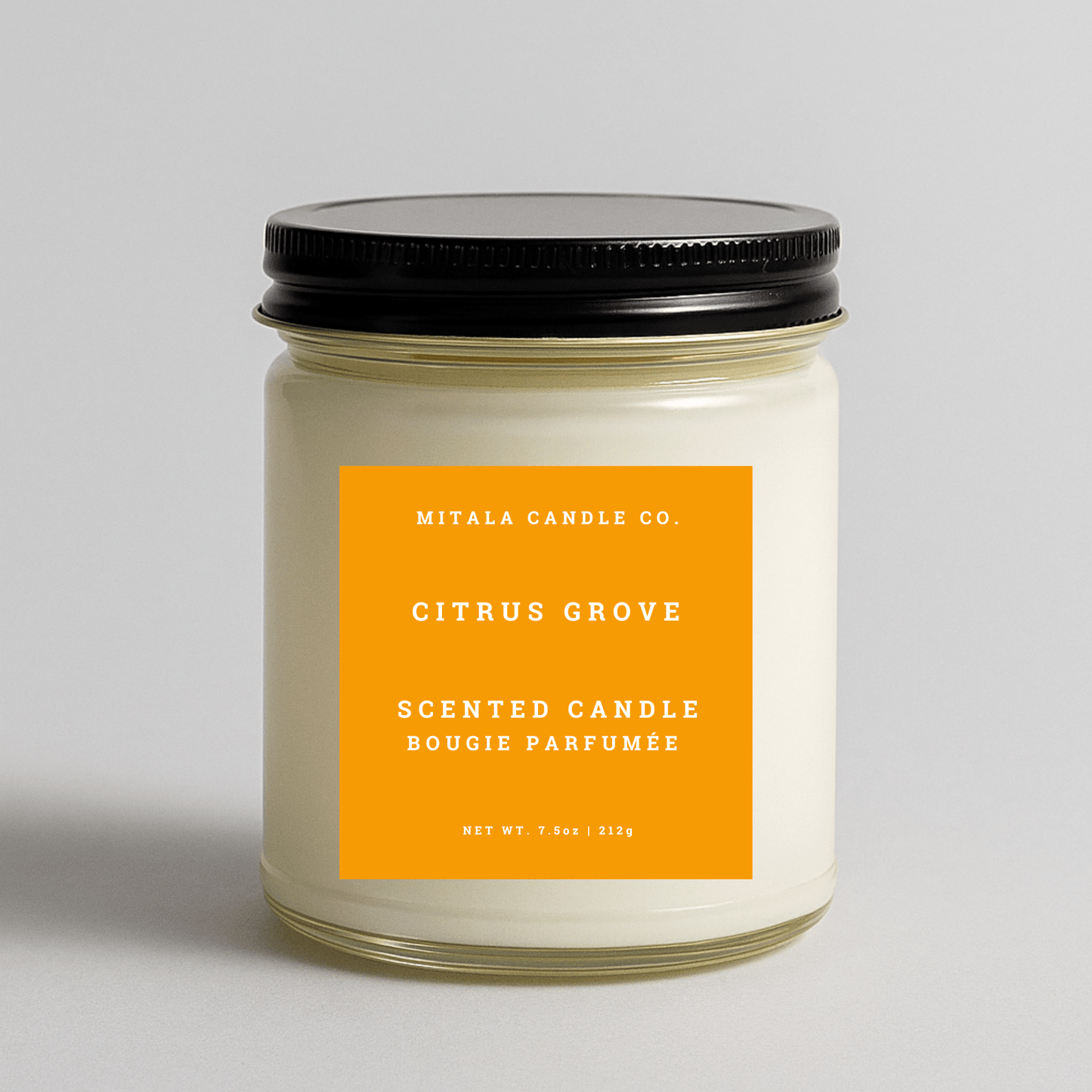 Mitala Candle Co. Citrus Grove scented candle with black lid, 7.5oz, on light gray background
