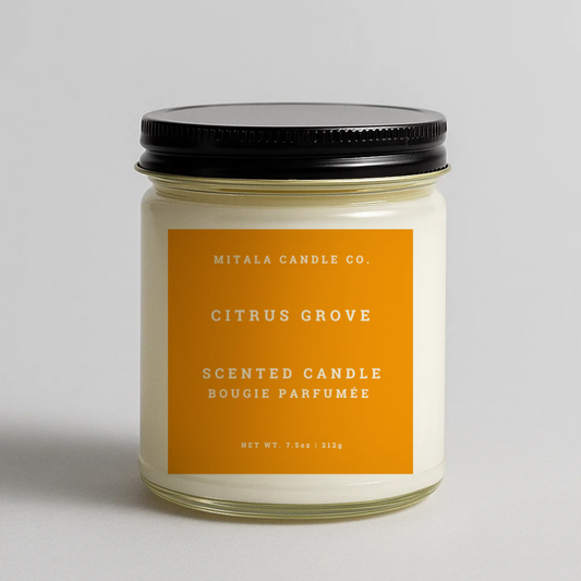 Mitala Candle Co. Citrus Grove scented candle with black lid, 7.5oz, on light gray background