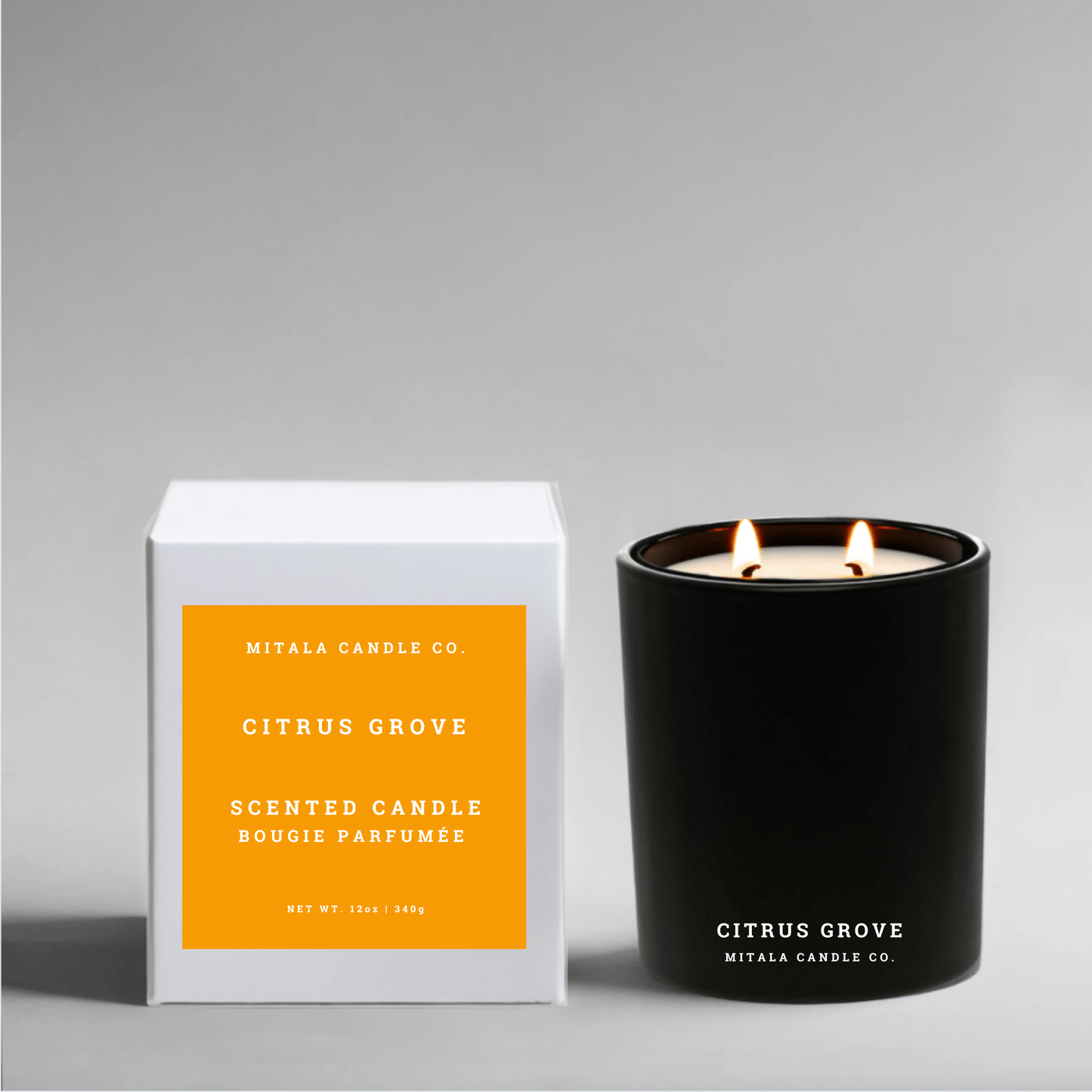Luxury soy candle with 'Citrus Grove' and white packaging on a gray background