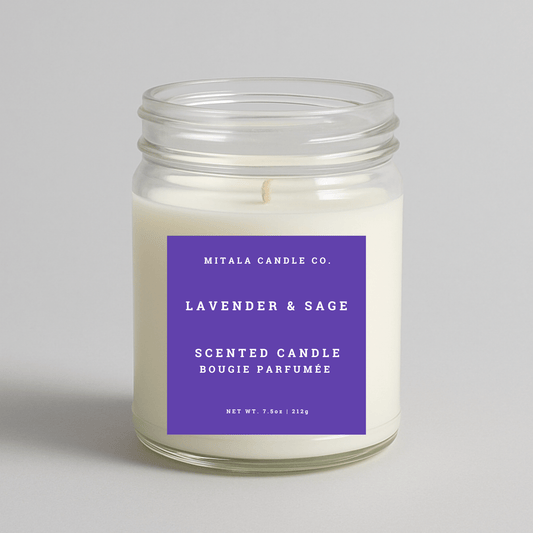 Mitala Candle Co. lavender & sage scented candle with a purple label on a light gray background