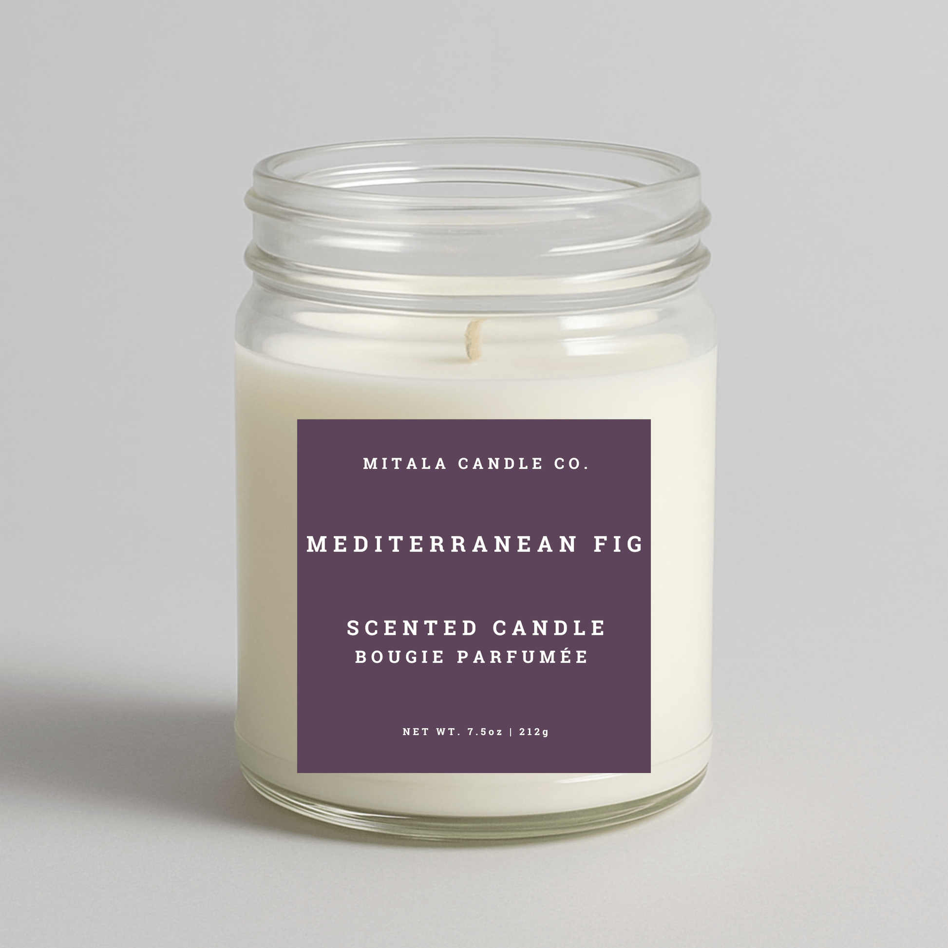 Mitala Candle Co. Mediterranean Fig scented candle with purple label, 7.5oz, on light gray background