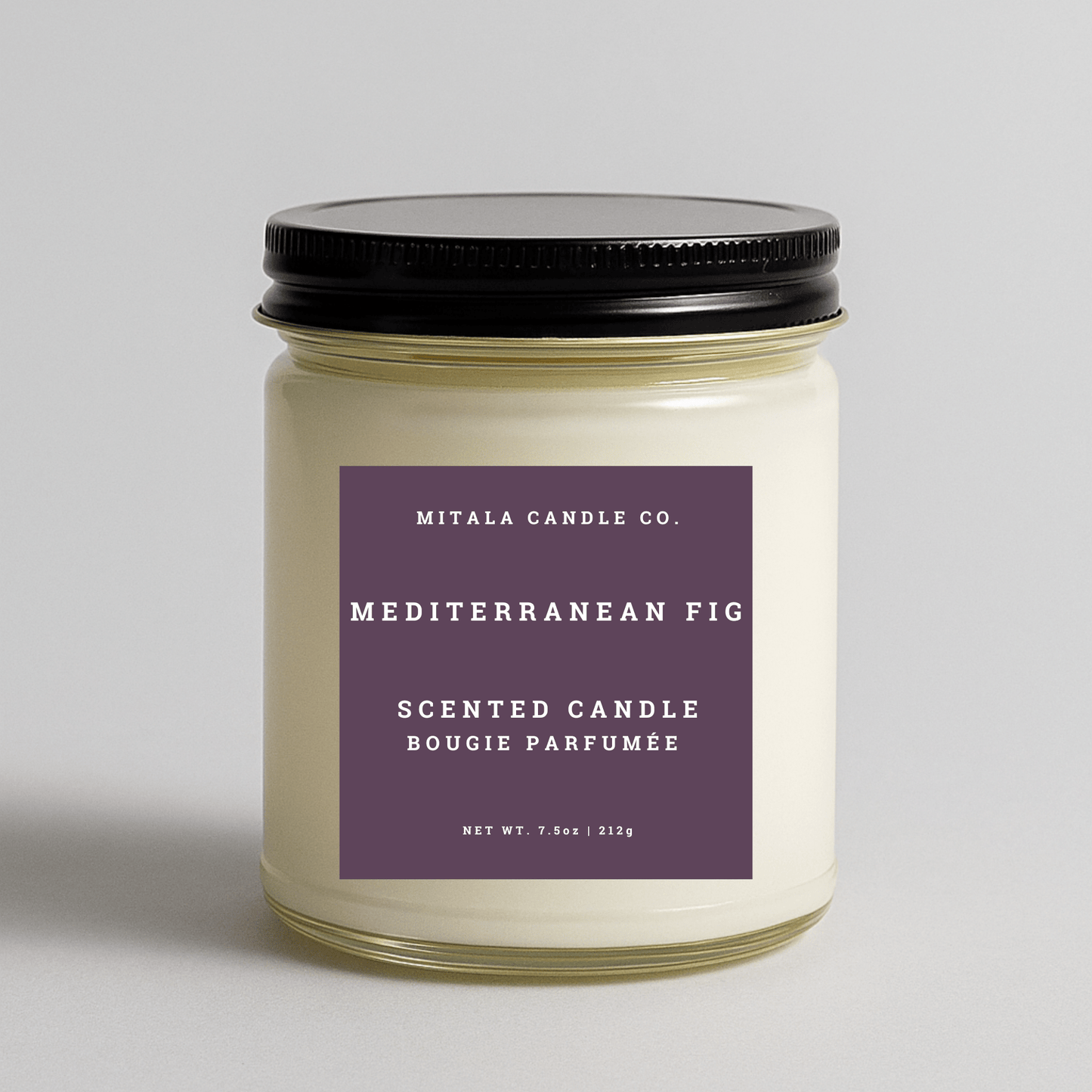 Mitala Candle Co. Mediterranean Fig scented candle with label and black lid, 7.5oz, on gray background