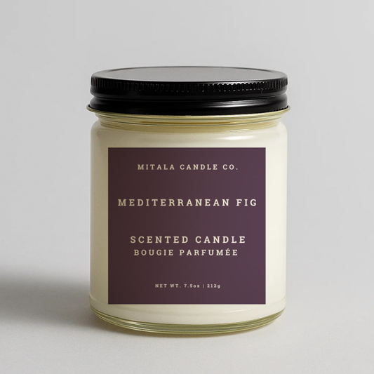 Mitala Candle Co. Mediterranean Fig scented candle with label and black lid, 7.5oz, on gray background