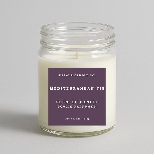 Mitala Candle Co. Mediterranean Fig scented candle with a purple label on a light gray background