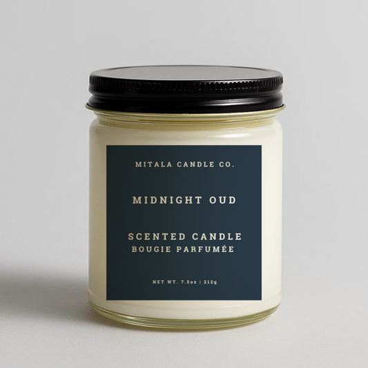 Mitala Candle Co. Midnight Oud scented candle with black lid, 7.5oz, on light gray background