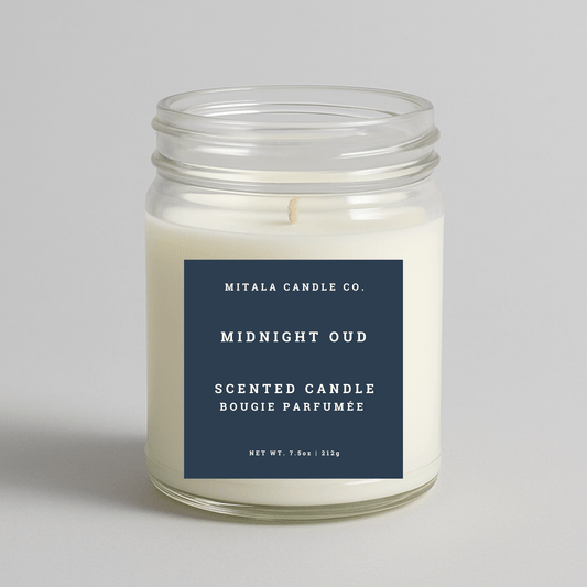 Mitala Candle Co. Midnight Oud scented candle with a blue label on a light gray background