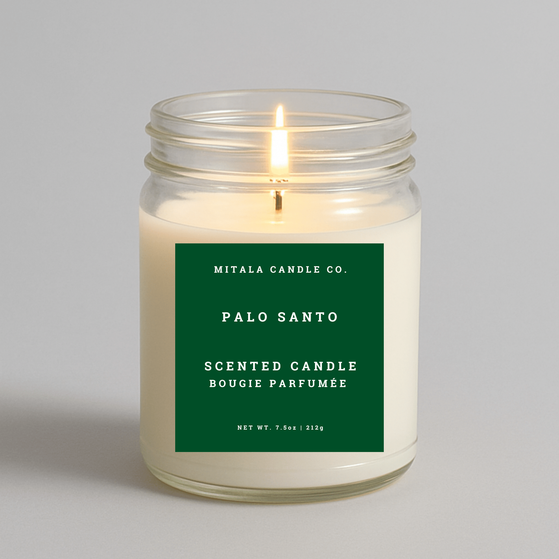 7.5oz Palo Santo scented candle by Mitala Candle Co. with green label, perfect for gifts or home decor
