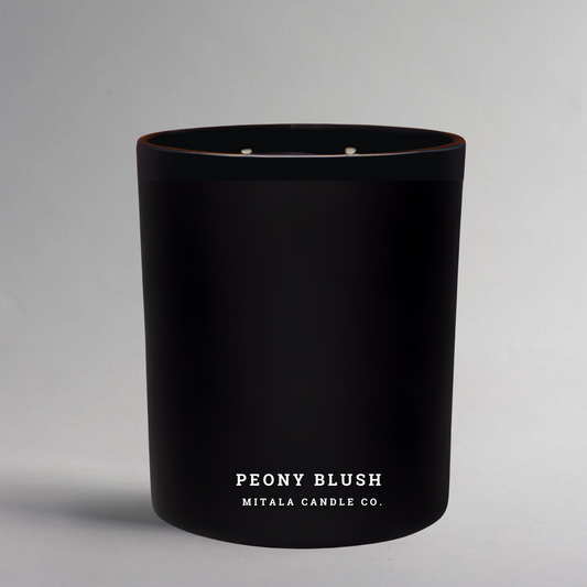 Peony Blush 12oz soy candle with cherry blossom, magnolia, peony, and amber. Luxury hand-poured floral candle in black jar by Mitala Candle Co.
