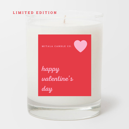 A Mitala andle Co. Limited Edition Happy  Valentine's Day candle with a red label reading 'happy Valentine's day' and 'Mitala Candle Co' on a white background.