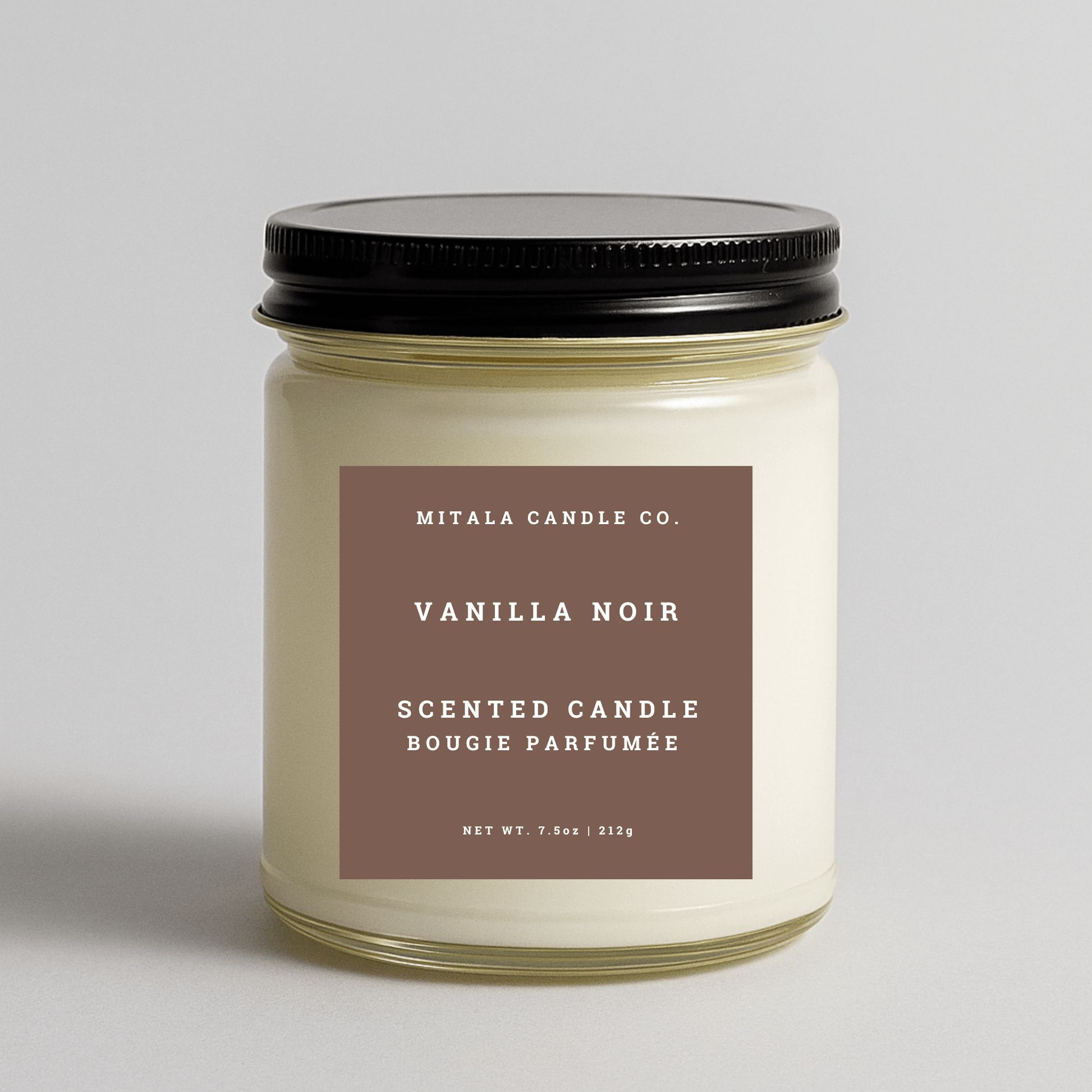 Mitala Candle Co. Vanilla Noir scented candle with black lid, 7.5oz, on light gray background