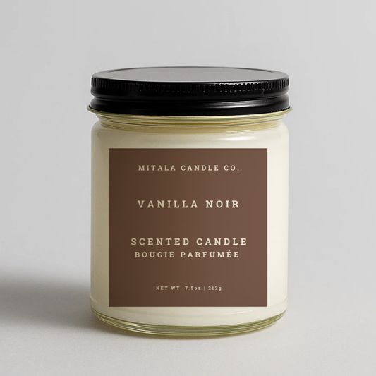 Mitala Candle Co. Vanilla Noir scented candle with black lid, 7.5oz, on light gray background