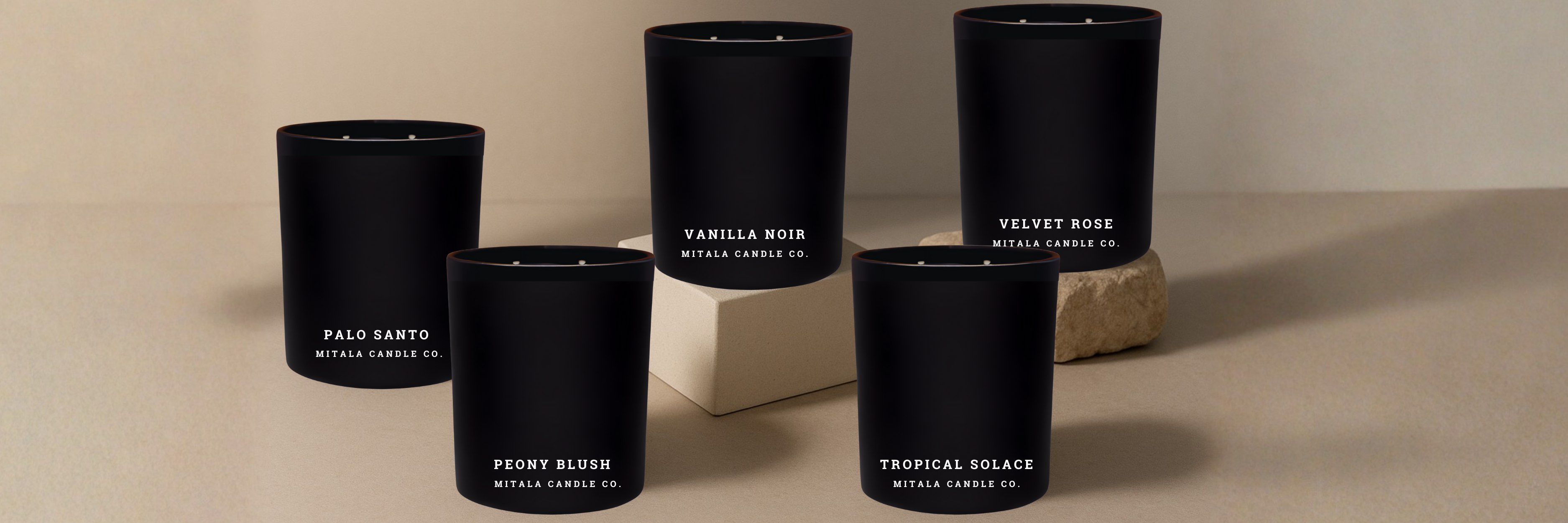 Set o Mitala candle co. classic scented candles in 12oz with labels on a beige background